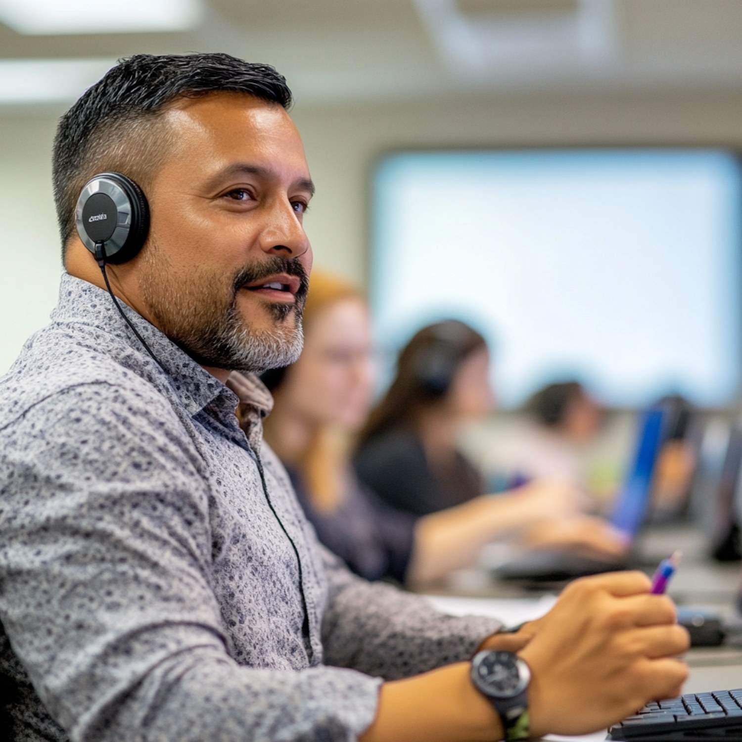 A person with headphones actively engaged in an online course on a tablet or laptop, highlighting the accessibility and convenience of e-learning.